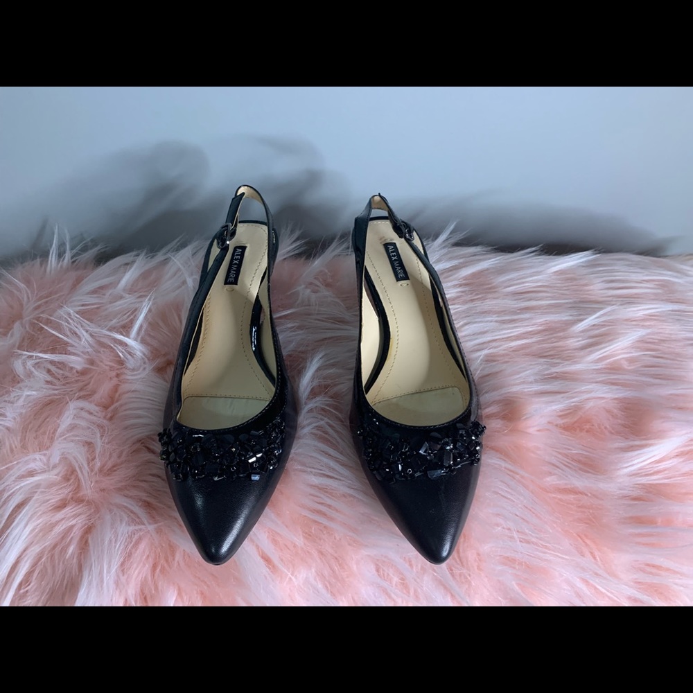 On the front it has black rhinestones that match the color of shoe.